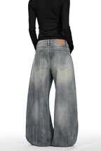 Distressed Curved Leg Jeans