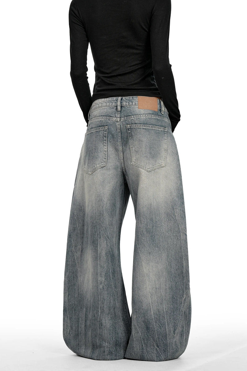 Distressed Curved Leg Jeans